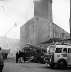 Workmen Drag Gas Cylinders From Mill Blaze (4 of 7)