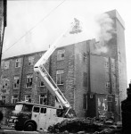 Workmen Drag Gas Cylinders From Mill Blaze (5 of 7)